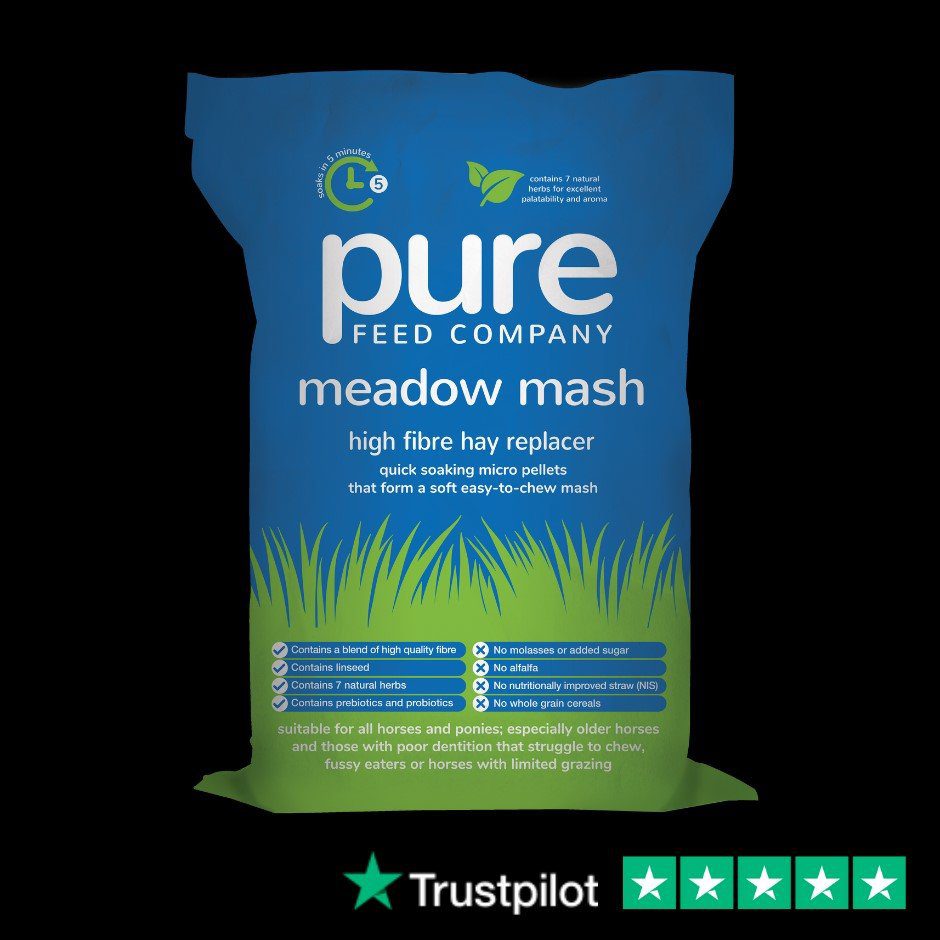 Bag of Pure Meadow Mash horse feed. The bag is blue with stylised green grass at the bottom, and text about the branding and key benefits of this hay replacer